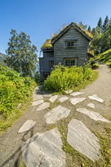Facade of wood house with grass roof in in the old Astruptunet farms complex, Jolster Facade of wood house with grass roof in in the old Astruptunet farms complex, Jolster