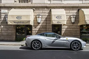 Ferrari car parked in front of the historic Cova coffehouse located in Via Montenapoleone Ferrari car parked in front of the historic Cova coffehouse located in Via Montenapoleone