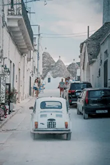 Fiat Cinquecento and traditional Trulli houses in Alberobello, Puglia, Italy, Europe Fiat Cinquecento and traditional Trulli houses in Alberobello, Puglia, Italy, Europe