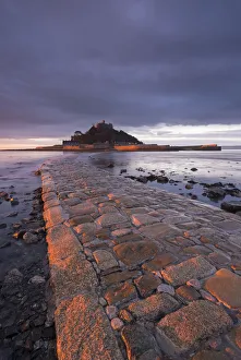 First light of day on the stone causeway leading to St Michaels Mount, Marazion, Cornwall First light of day on the stone causeway leading to St Michaels Mount, Marazion, Cornwall