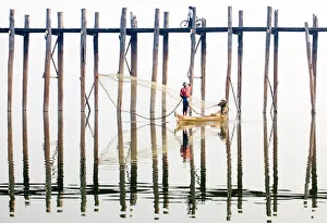 Fishermen next to the U Bein Bridge, a 1 Fishermen next to the U Bein Bridge, a 1