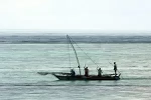Images Dated 24th October 2014: Fishing boat in the Indian Ocean, pre-dawn, East Coast Unguja Island, Zanzibar, Tanzania