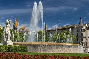 Fountain in Plaza Catalunya with Casa Rocamora modernist building behind, Barcelona Fountain in Plaza Catalunya with Casa Rocamora modernist building behind, Barcelona
