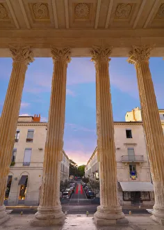 France, Provence, Nimes, Maison Caree, view through columns at dusk France, Provence, Nimes, Maison Caree, view through columns at dusk