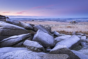 Frost covered granite boulders at Great Staple Tor in Dartmoor National Park, Devon, England Frost covered granite boulders at Great Staple Tor in Dartmoor National Park, Devon, England