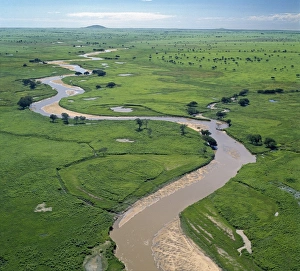 The Garamba River winds it way through the grasslands of the Garamba National Park in Northern Congo The Garamba River winds it way through the grasslands of the Garamba National Park in Northern Congo