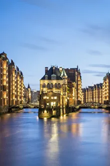 Germany, Hamburg, Speicherstadt. Historic Wasserschloss at dusk, view from the Germany, Hamburg, Speicherstadt. Historic Wasserschloss at dusk, view from the
