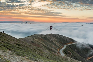 Golden Gate Bridge with morning fog shot at sunrise from Slackers Hill. San Francisco Golden Gate Bridge with morning fog shot at sunrise from Slackers Hill. San Francisco