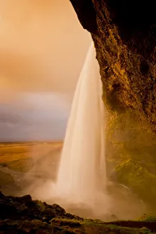 Golden Light on Seljalandsfoss Waterfall, Iceland Golden Light on Seljalandsfoss Waterfall, Iceland