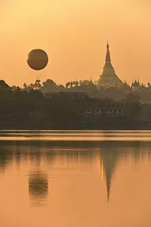 Rangoon Collection: The golden stupa of the Shwedagon Pagoda and the Mingalarbar hot air baloon reflected in