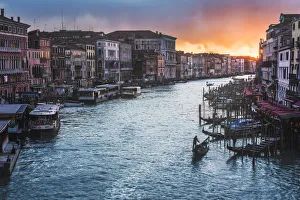 Gondolas on the Grand Canal at sunset, Venice, Veneto, Italy Gondolas on the Grand Canal at sunset, Venice, Veneto, Italy
