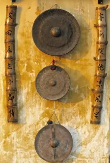 Vietnamese Collection: Gongs hanging on a wall