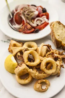 Greece, Athens, tomato and onion salad with fired calamari Greece, Athens, tomato and onion salad with fired calamari