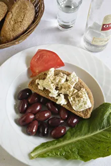 Greek Cuisine. Traditional Meze (Starter) Cretan Dakos with a glass of Ouzo Greek Cuisine. Traditional Meze (Starter) Cretan Dakos with a glass of Ouzo
