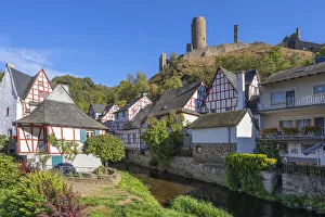 Half-timbered houses at Monreal with Philippsburg castle ruin, Eifel Half-timbered houses at Monreal with Philippsburg castle ruin, Eifel