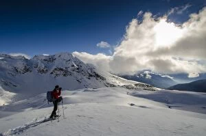 Images Dated 7th December 2014: An hiker its photographing the winter landscape (Val d Ayas, Vallee d Aoste)