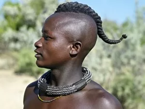 Images Dated 14th June 2006: A Himba youth with his hair styled in a long plait, known as ondatu