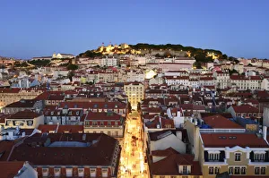 The historic centre (Baixa) and Sao Jorge castle at twilight. Lisbon, Portugal The historic centre (Baixa) and Sao Jorge castle at twilight. Lisbon, Portugal