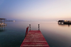 Honduras, Bay Islands, Utila, Red jetty at sunset Honduras, Bay Islands, Utila, Red jetty at sunset