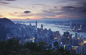 Hong Kong Island and Kowloon skylines at sunset, Hong Kong, China Hong Kong Island and Kowloon skylines at sunset, Hong Kong, China