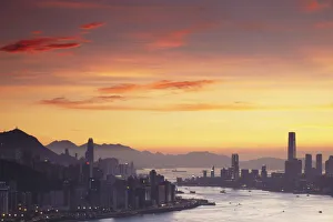 Hong Kong Island and Tsim Sha Tsui skylines at sunset, Hong Kong, China Hong Kong Island and Tsim Sha Tsui skylines at sunset, Hong Kong, China