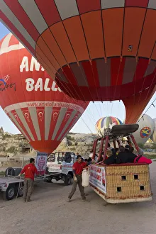 Hot Air Balloon being inflated for take off, near Goreme, Cappadocia, Anatolia, Turkey Hot Air Balloon being inflated for take off, near Goreme, Cappadocia, Anatolia, Turkey