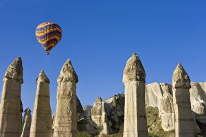 Hot Air balloon over the Phallic pillars (Fairy Chimneys), Love Valley, near Goreme Hot Air balloon over the Phallic pillars (Fairy Chimneys), Love Valley, near Goreme