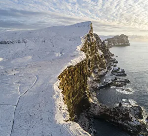 The huge cliffs at Eggjarnar, south of the village of Vagur. Island of Suðuroy. Faroe Islands The huge cliffs at Eggjarnar, south of the village of Vagur. Island of Suðuroy. Faroe Islands