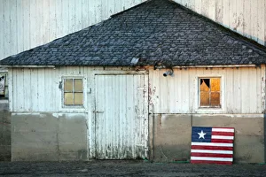 Idaho, USA. An american flag in front of a barn Idaho, USA. An american flag in front of a barn