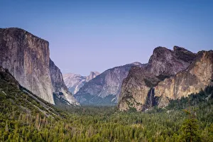 Idyllic shot of alpine forest amidst rocky mountains at Tunnel View Idyllic shot of alpine forest amidst rocky mountains at Tunnel View