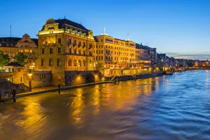 Illuminated Hotels at river Rhine at Basel at dusk, Canton Basel, Switzerland Illuminated Hotels at river Rhine at Basel at dusk, Canton Basel, Switzerland