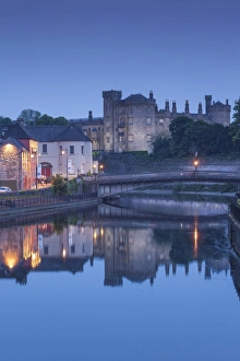 Ireland, County Kilkenny, Kilkenny City, pubs along River Nore and Kilkenny Castle, dusk Ireland, County Kilkenny, Kilkenny City, pubs along River Nore and Kilkenny Castle, dusk