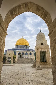 Israel, Jerusalem, Temple Mount, Man walking past Dome of the Rock and Sabil of Qairbay Israel, Jerusalem, Temple Mount, Man walking past Dome of the Rock and Sabil of Qairbay