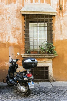 Rome Collection: Italian Vespa scooter parked in a cobblestone street of Rome, Lazio, Italy