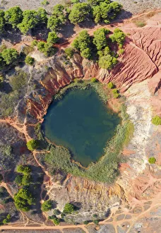Italy. Apulia (Puglia). Otranto Province, Bauxite Cave and emerald lake Italy. Apulia (Puglia). Otranto Province, Bauxite Cave and emerald lake