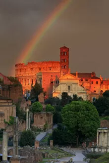 Rainbow Collection: Italy, Rome, rainbow over Colosseum and Roman Forum at sunset