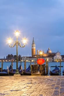 Images Dated 9th November 2014: Italy, Veneto, Venice. Woman with red umbrella on Riva degli Schiavoni at dawn (MR)