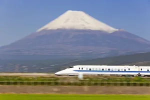 Japan, Houshu, Shinkansen (Bullet train) which reaches speeds of up to 300km/h passing Japan, Houshu, Shinkansen (Bullet train) which reaches speeds of up to 300km/h passing