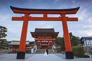 Japan, Kyoto, A wedding bride and groom pose at Fushimi Inari Shrine Japan, Kyoto, A wedding bride and groom pose at Fushimi Inari Shrine