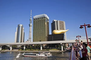 Images Dated 22nd December 2011: Japan, Tokyo, Asakusa, Sumida River and Business Area Skyline