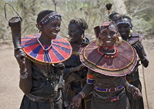 Jovial Pokot women celebrate an Atelo ceremony. The Pokot are pastoralists speaking a Southern Nilotic Jovial Pokot women celebrate an Atelo ceremony. The Pokot are pastoralists speaking a Southern Nilotic