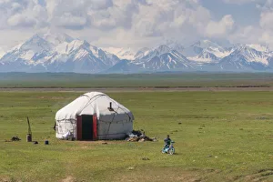 Kyrgyzstan landscape with a Yurt and children in foreground Kyrgyzstan landscape with a Yurt and children in foreground