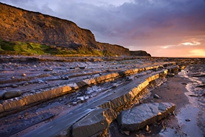 Late evening sunlight glows on the horizontal ledges of Kilve, Somerset, England Late evening sunlight glows on the horizontal ledges of Kilve, Somerset, England