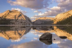 Late evening sunlight turns the granite mountains above Tenaya Lake to gold, Yosemite Late evening sunlight turns the granite mountains above Tenaya Lake to gold, Yosemite