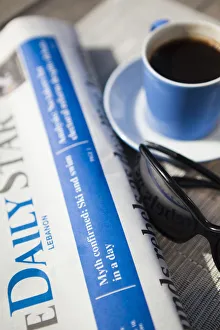 Lebanon, Beirut. Early morning newspaper and coffee Lebanon, Beirut. Early morning newspaper and coffee