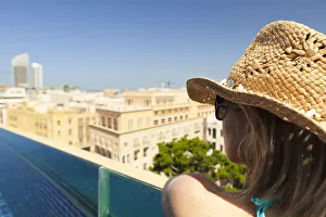 Lebanon, Beirut. A woman looks out over Beirut from the rooftop pool of the Le Gray Hotel Lebanon, Beirut. A woman looks out over Beirut from the rooftop pool of the Le Gray Hotel