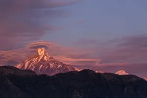 Annapurna Gallery: Lenticular clouds at sunset above Machapuchare, Himalayas, Nepal