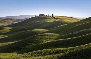 Lonely house into the hills in Asciano outskirt, Siena Province, Tuscany, Italy Lonely house into the hills in Asciano outskirt, Siena Province, Tuscany, Italy