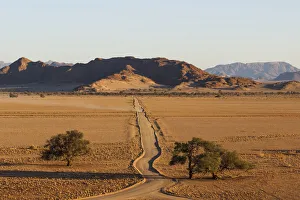Lonely road to the Savannah; Damarland; Namibia; Southern Africa Lonely road to the Savannah; Damarland; Namibia; Southern Africa