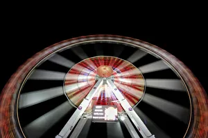 Long exposure of illuminated ferris wheel at Hamburger DOM funfair at night, St. Pauli Long exposure of illuminated ferris wheel at Hamburger DOM funfair at night, St. Pauli